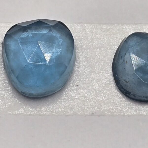 FOUR rose-cut London blue topaz cabochons