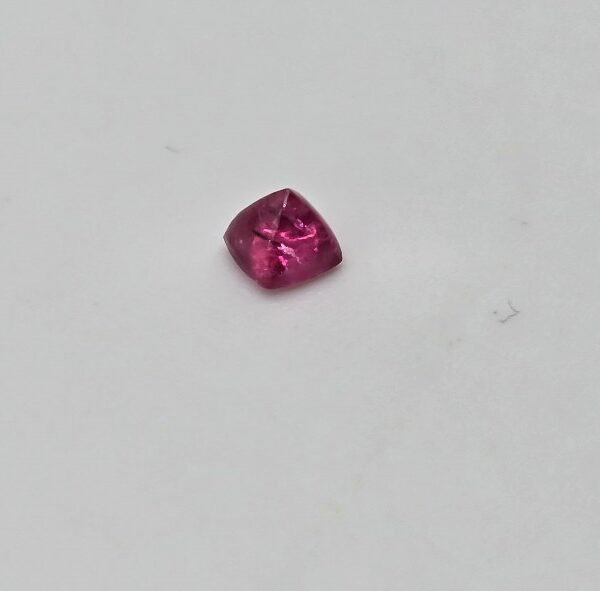 3.36x3.35x2.82mm spinel sugarloaf-cut cabochon