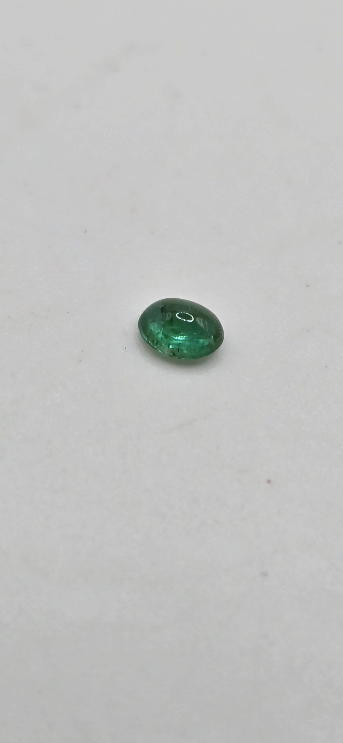 4.96x3.90x2.50mm oval-cut hq Zambian emerald cabochon