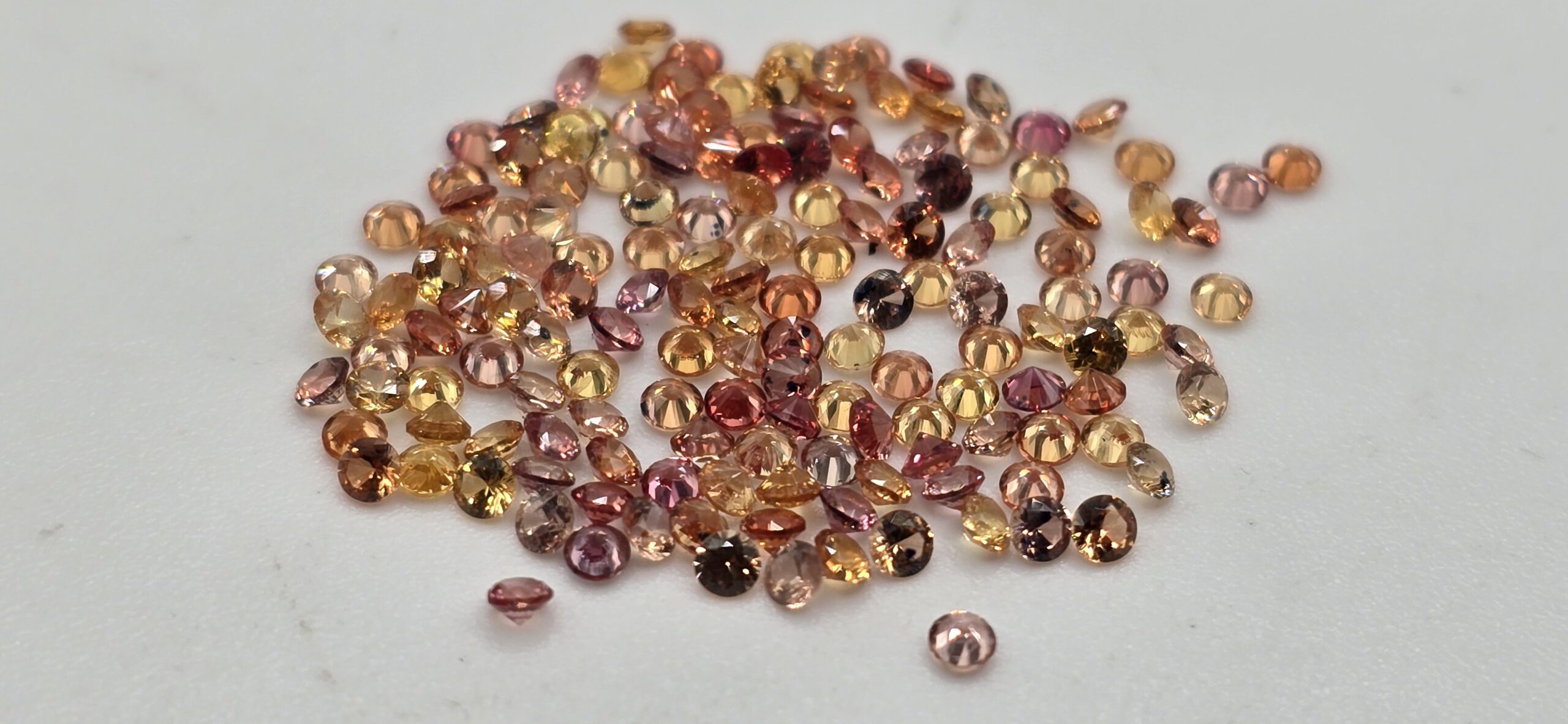 5ct parcel of 1.8mm orange mix sapphire facets