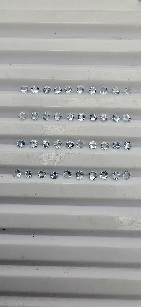 0.51ct parcel of 2.11 2.20mm melee round aquamarine facets