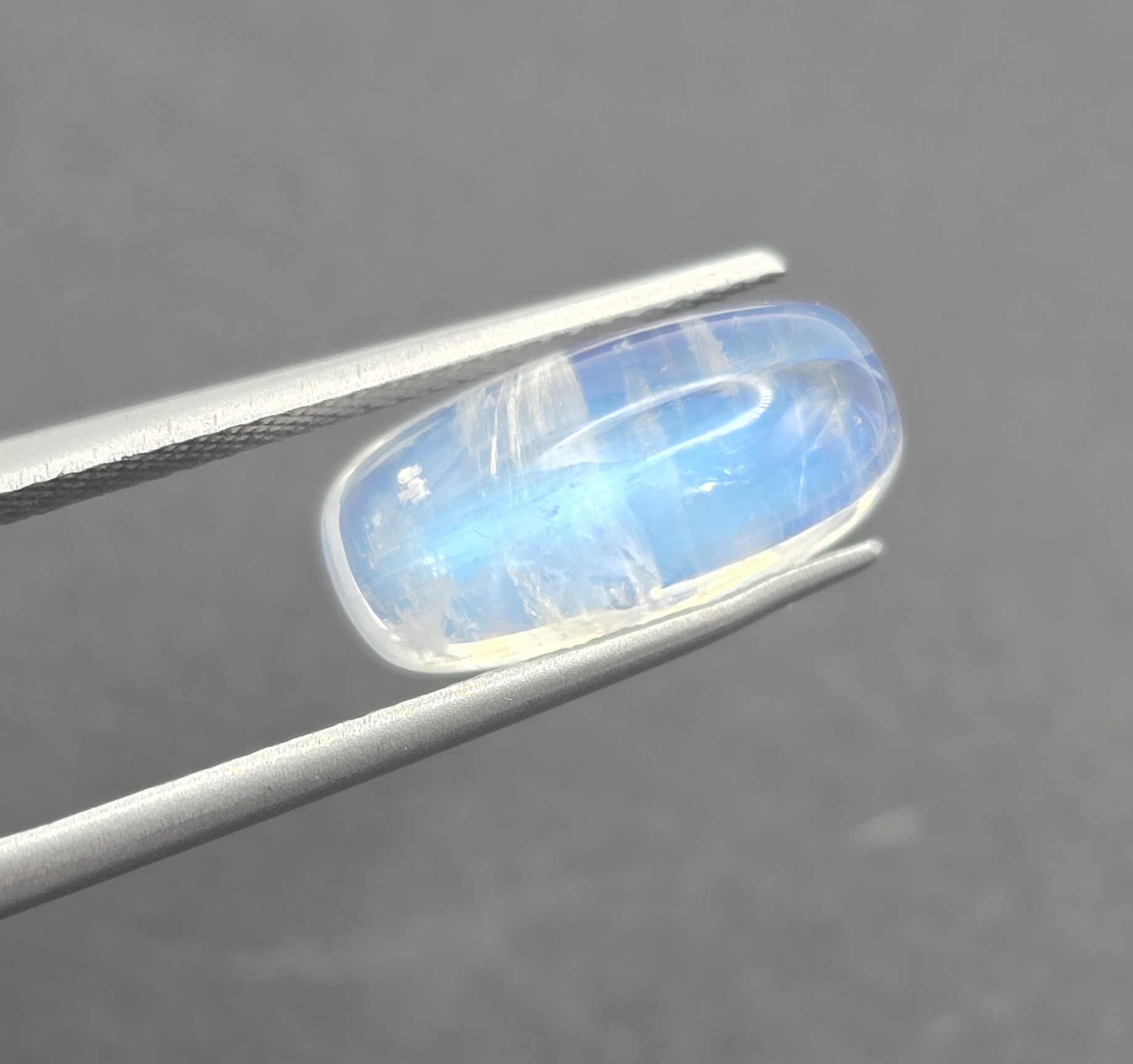 14.4x7.1x5.8mm cushion gem-grade rainbow moonstone cabochon