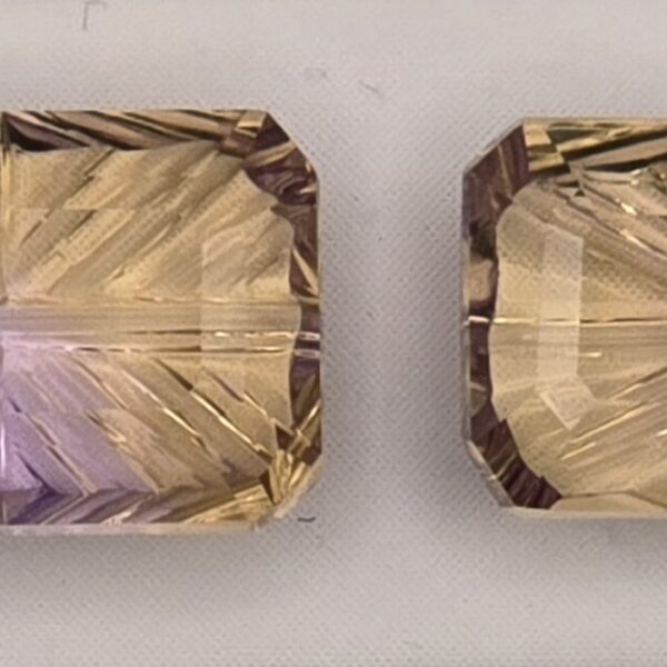12.06x7.60x4.79mm & 13.10x7.21x4.38mm pair of fantasy-cut, high quality ametrine facets
