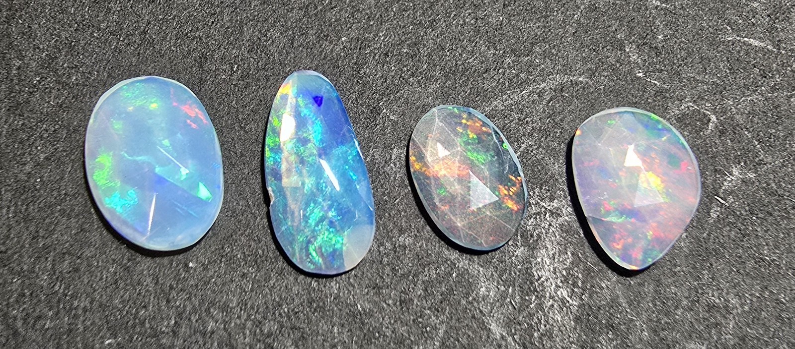 FOUR rose-cut Ethiopian opal cabochons