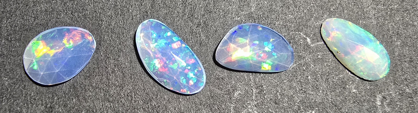 FOUR rose-cut Ethiopian opal cabochons
