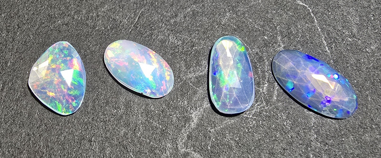 FOUR rose-cut Ethiopian opal cabochons