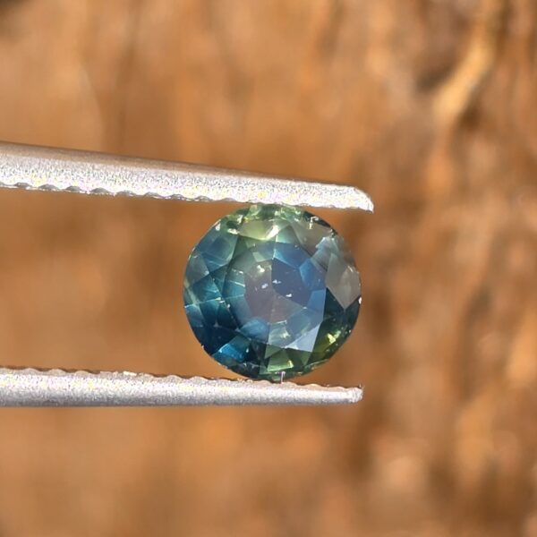5.62x5.58x3.45mm natural round Australian deep parti sapphire facet