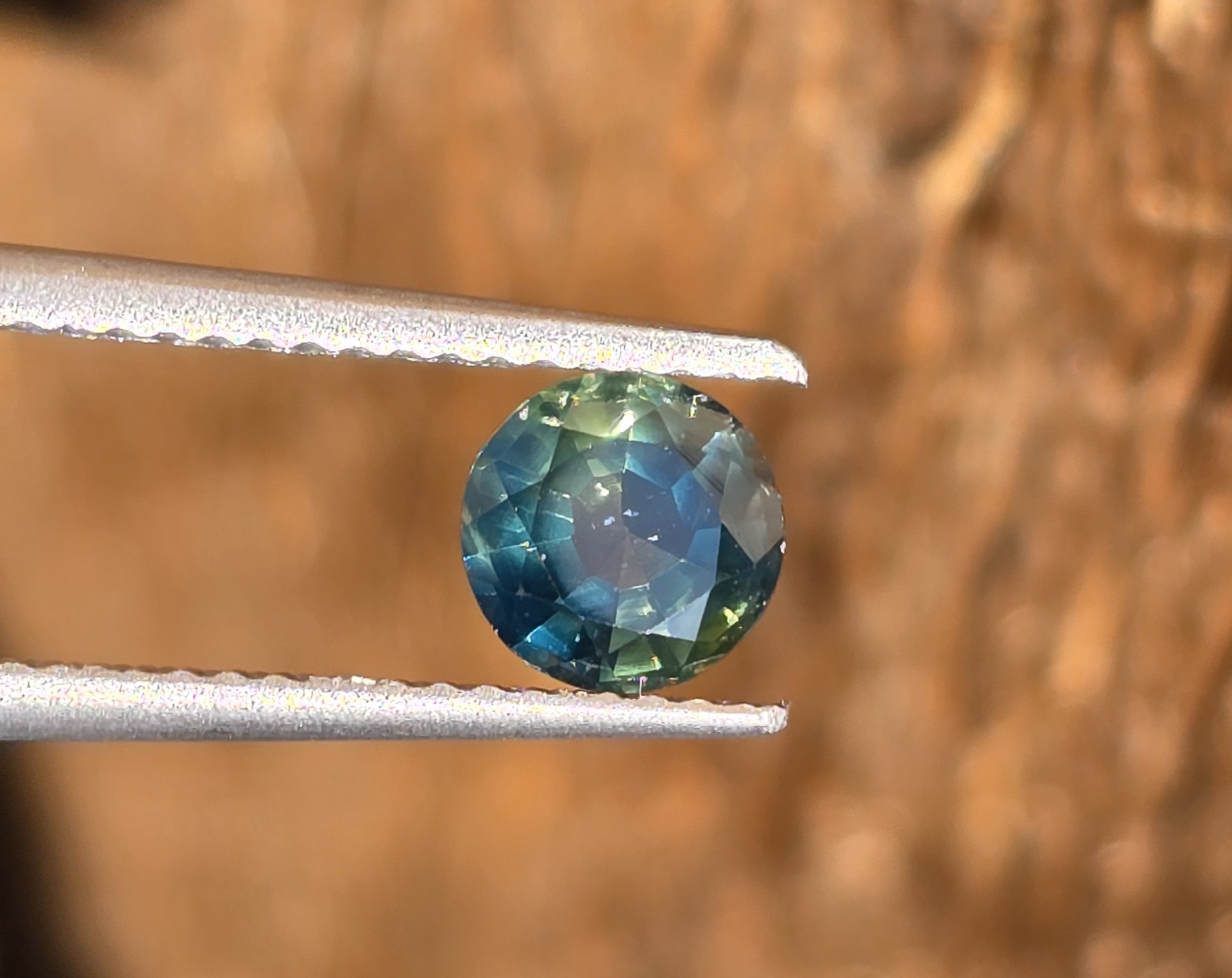 5.62x5.58x3.45mm natural round Australian deep parti sapphire facet