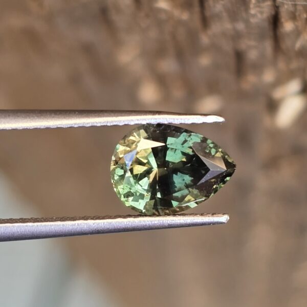 9.09x6.63x4.50mm natural pear Australian deep green sapphire facet